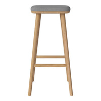 Gray upholstered seat with light wood legs, featuring a simple, modern design for a sleek aesthetic.