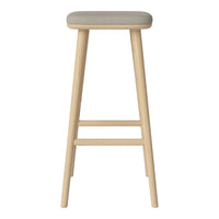Light wood bar stool with a soft gray upholstered seat, featuring clean lines and a minimalist design.