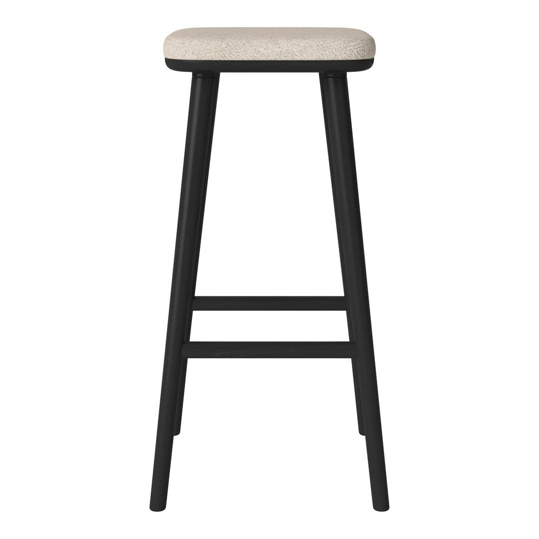 "Black bar stool with a light beige patterned seat and sleek, modern design."