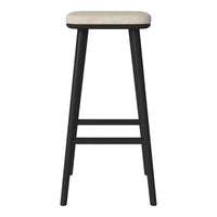 "Black bar stool with a light beige patterned seat and sleek, modern design."