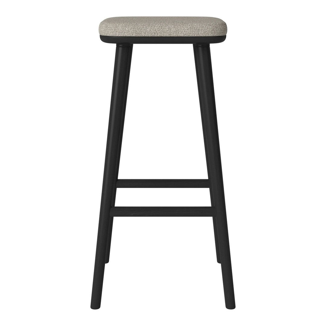 Black bar stool with a neutral beige cushion, featuring a simple solid pattern for a modern look.