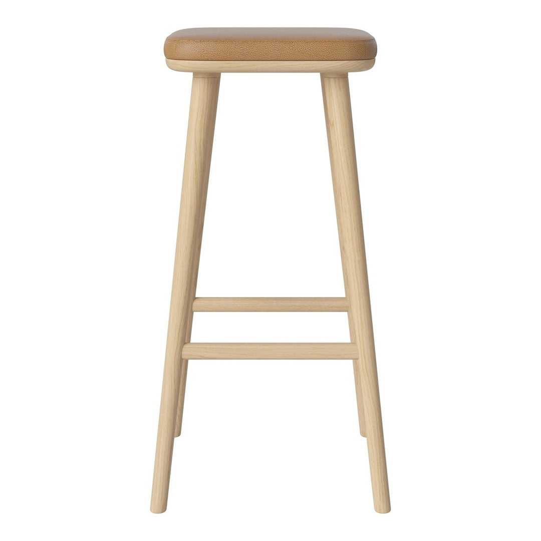 Light wood bar stool with a smooth, tan cushion seat, featuring a minimalist design and no visible patterns.