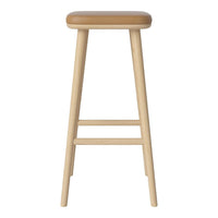 Light wood bar stool with a smooth, tan cushion seat, featuring a minimalist design and no visible patterns.