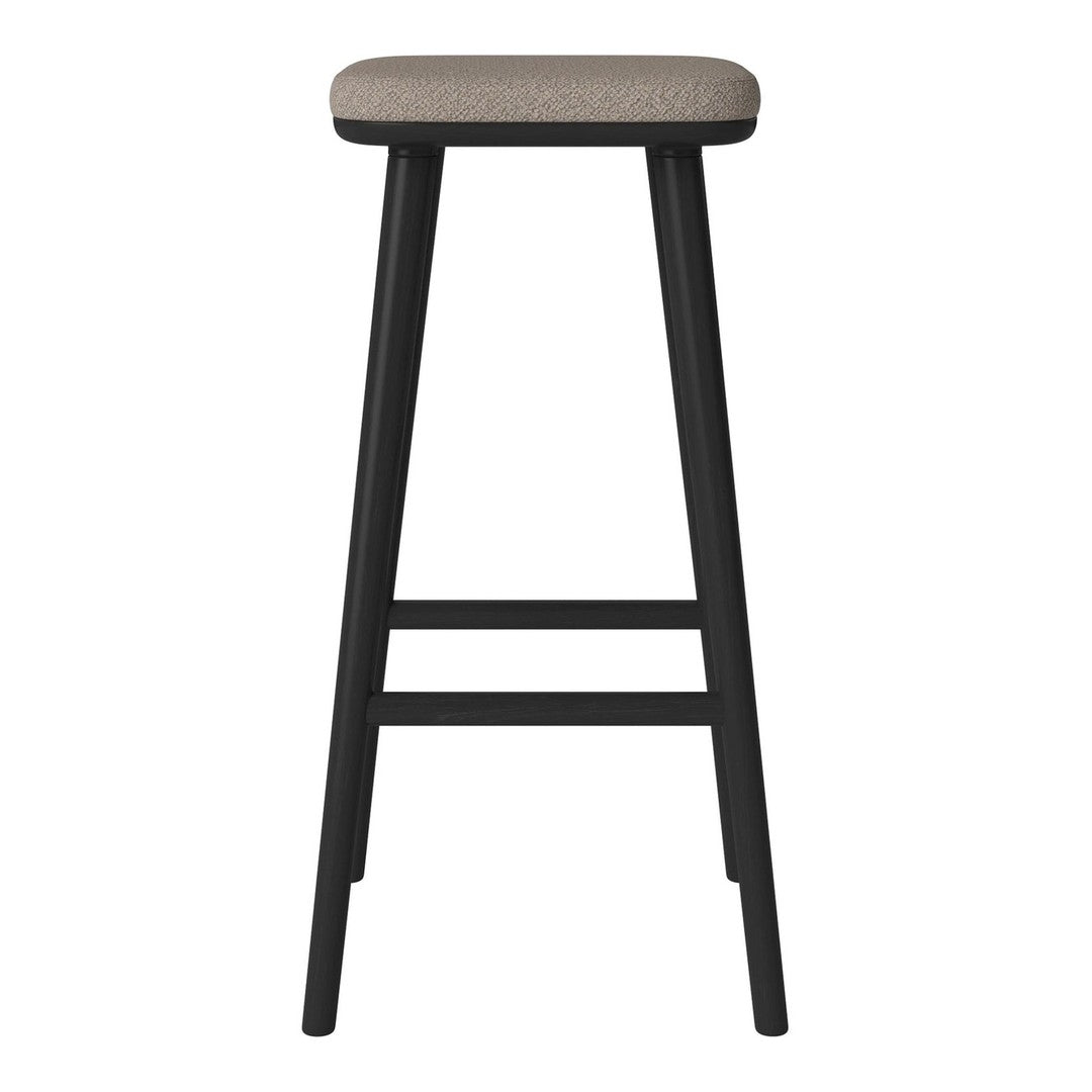 Black wooden bar stool with a simple rectangular beige fabric seat, featuring a minimalist design.