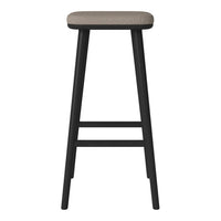 Black wooden bar stool with a simple rectangular beige fabric seat, featuring a minimalist design.
