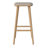 Light beige upholstered stool with natural wood legs, featuring a simple, modern design and subtle texture.