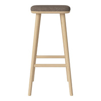 Light wood bar stool with a textured brown seat, featuring a minimalist design and natural finish.