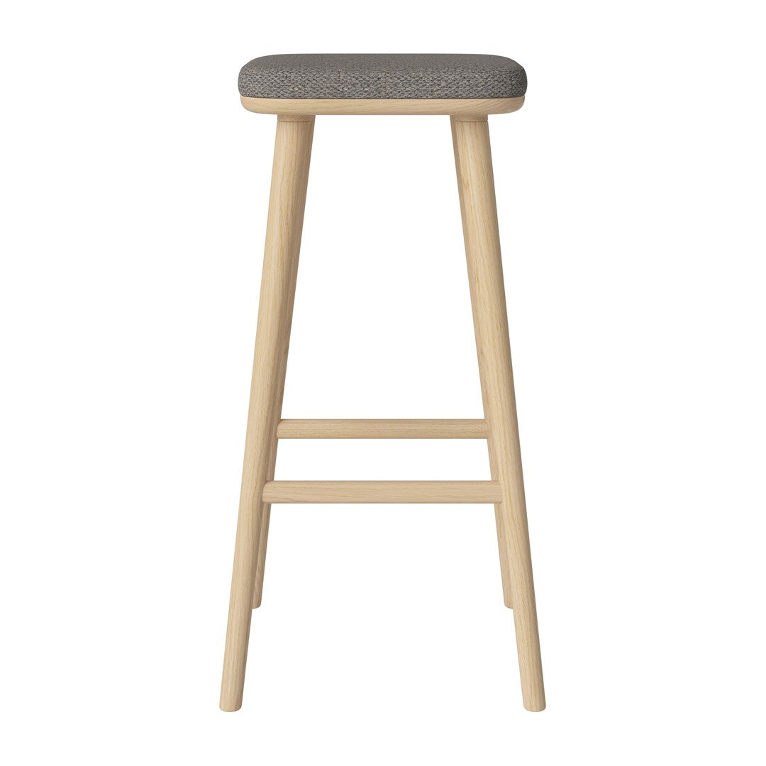 Light wood bar stool with a textured gray fabric seat, showcasing a minimalist and modern design.