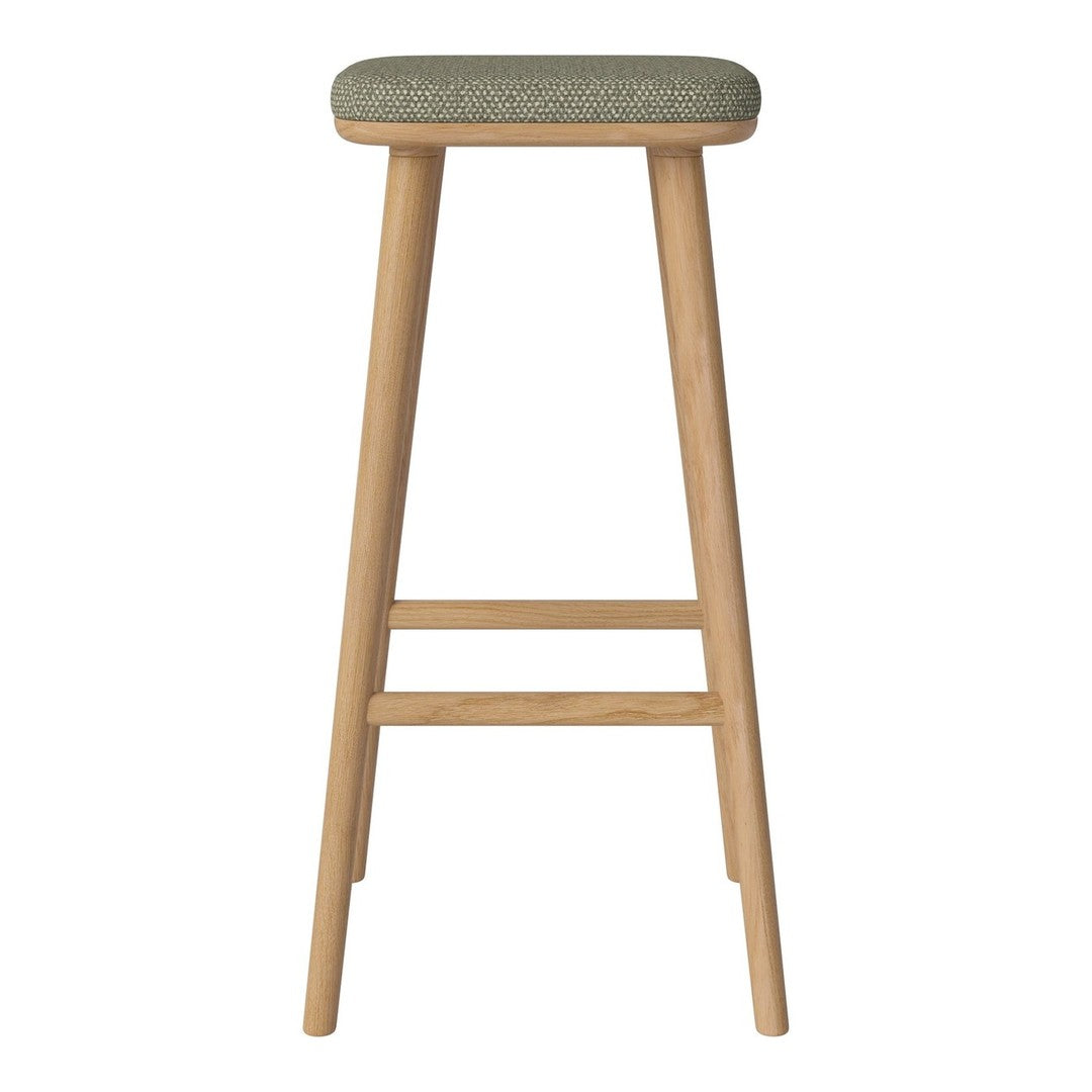 Green patterned upholstery on a natural wood bar stool with a sleek, minimalist design.