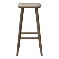 Beige upholstered stool with a natural wood finish, featuring clean lines and a minimalist design.