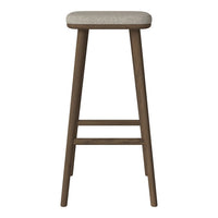 "Brown wooden bar stool with a textured beige seat, perfect for modern or rustic decor."