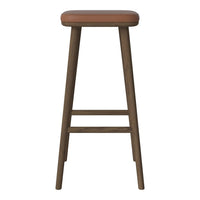 "Brown leather cushion on a sleek wooden bar stool with a natural finish."