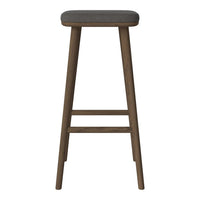 Gray upholstered stool with wooden legs in a sleek, minimalistic design. Perfect for modern interiors.