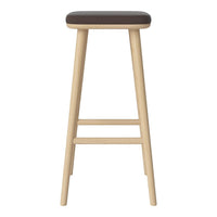 Neutral wooden bar stool with a sleek, dark brown padded seat. Simple, modern design with a smooth finish.