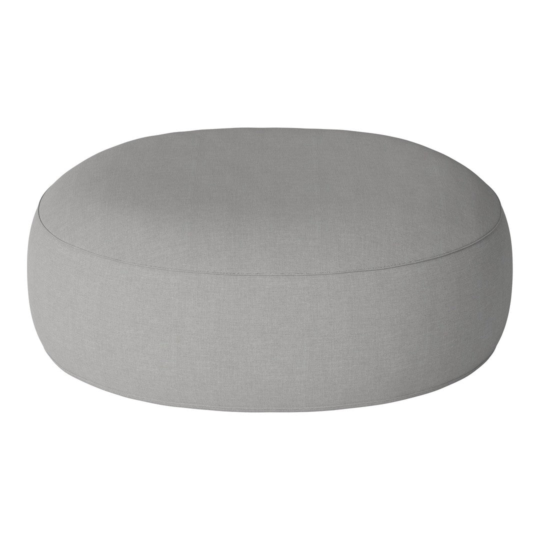 Round, light gray pouf with a smooth, minimalist design and subtle texture. Ideal for modern decor.