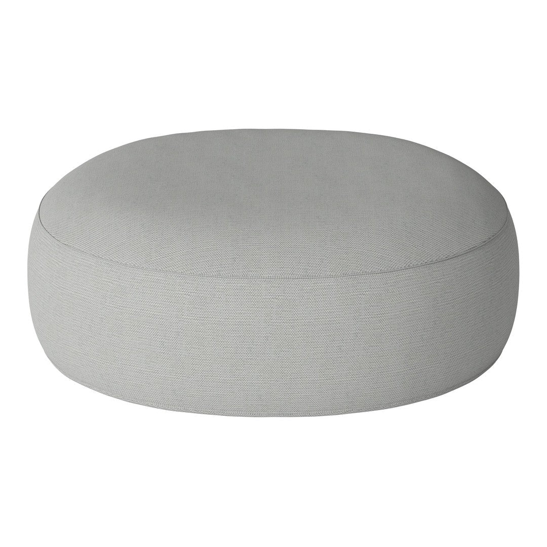 Gray round ottoman with a smooth, subtle texture and no visible patterns, perfect for modern decor.