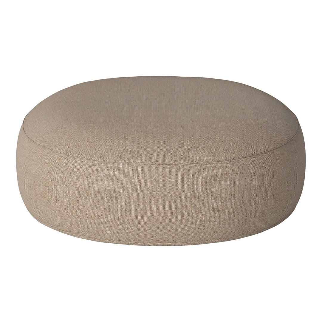 Round beige pouf with a smooth texture, perfect for minimalist decor and versatile seating options.