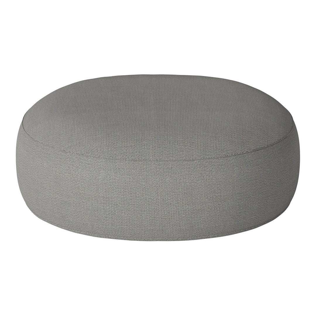 Round gray pouf with a smooth, textured fabric surface, perfect for modern decor styling.