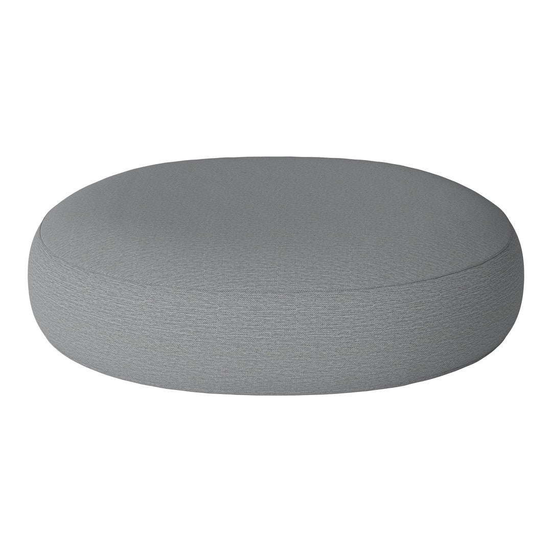 Round gray pouf with a textured fabric surface, perfect for modern decor.