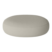 Round, soft ottoman in a light beige color with a smooth, solid pattern, perfect for modern home decor.