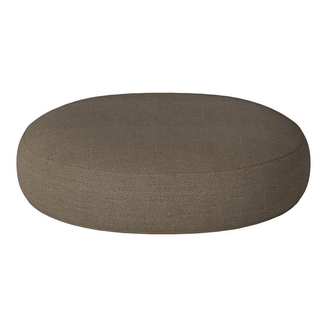 Round brown cushion with a smooth, textured fabric surface, perfect for modern home decor.
