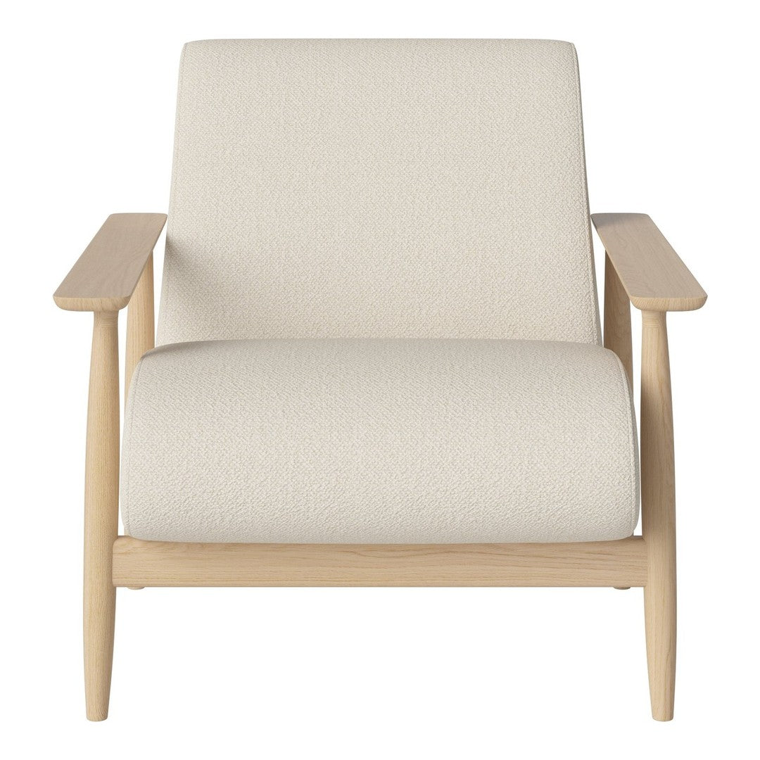 Cream upholstered chair with light wood arms, featuring a minimalist design and textured fabric for a cozy feel.