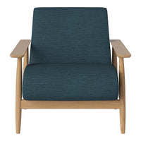 Teal textured fabric armchair with natural wood frame, minimalist design, and modern aesthetic.