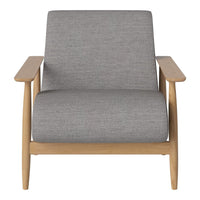Gray upholstered armchair with a natural wood frame, featuring a simple and modern design.
