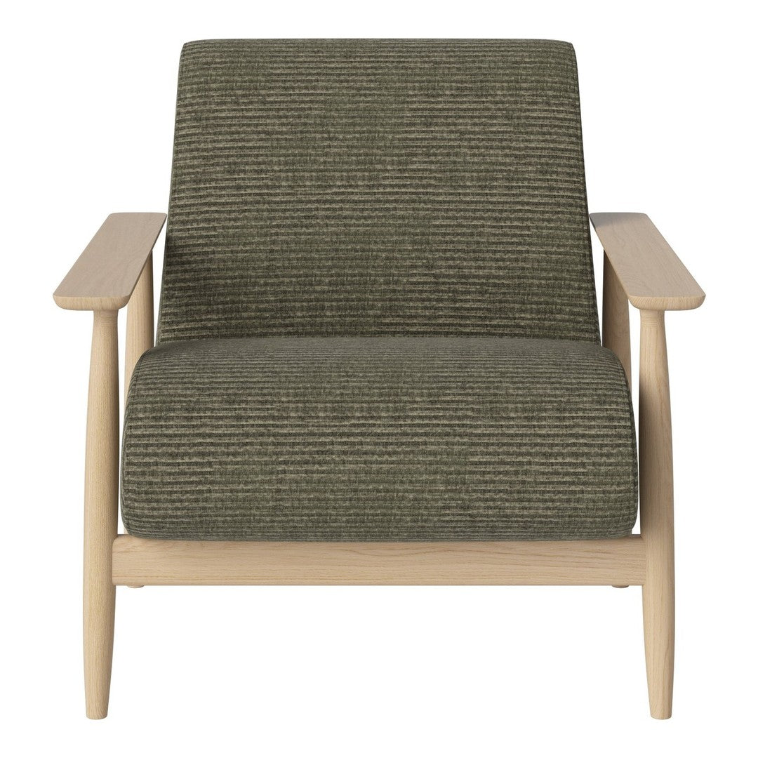 Green striped upholstery on a modern armchair with light wooden frame and minimalist design.