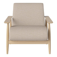 Beige upholstered chair with a smooth texture and light wood frame, showcasing a minimalist design.