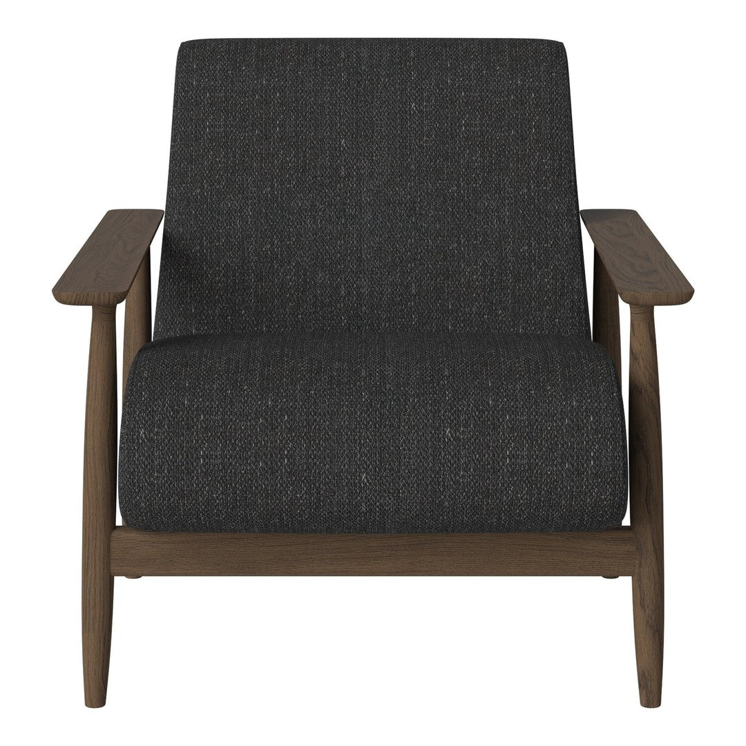 Dark gray textured upholstery on modern armchair with natural wood arms and legs. Elegant minimalist design.