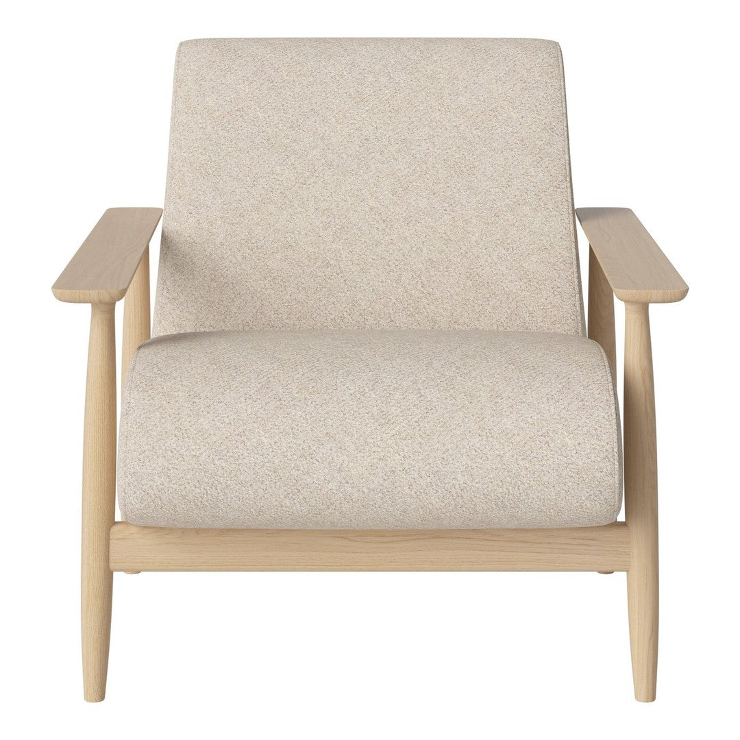Light beige upholstered chair with a subtle texture, set on natural wood legs, offering a minimalist design.