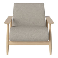 Light grey upholstered armchair with natural wood legs, minimalist design and no visible patterns.