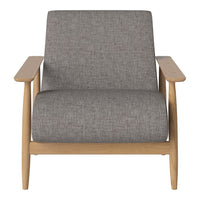 Gray textured upholstery on a modern armchair with natural wood armrests and legs. Simple, elegant design.