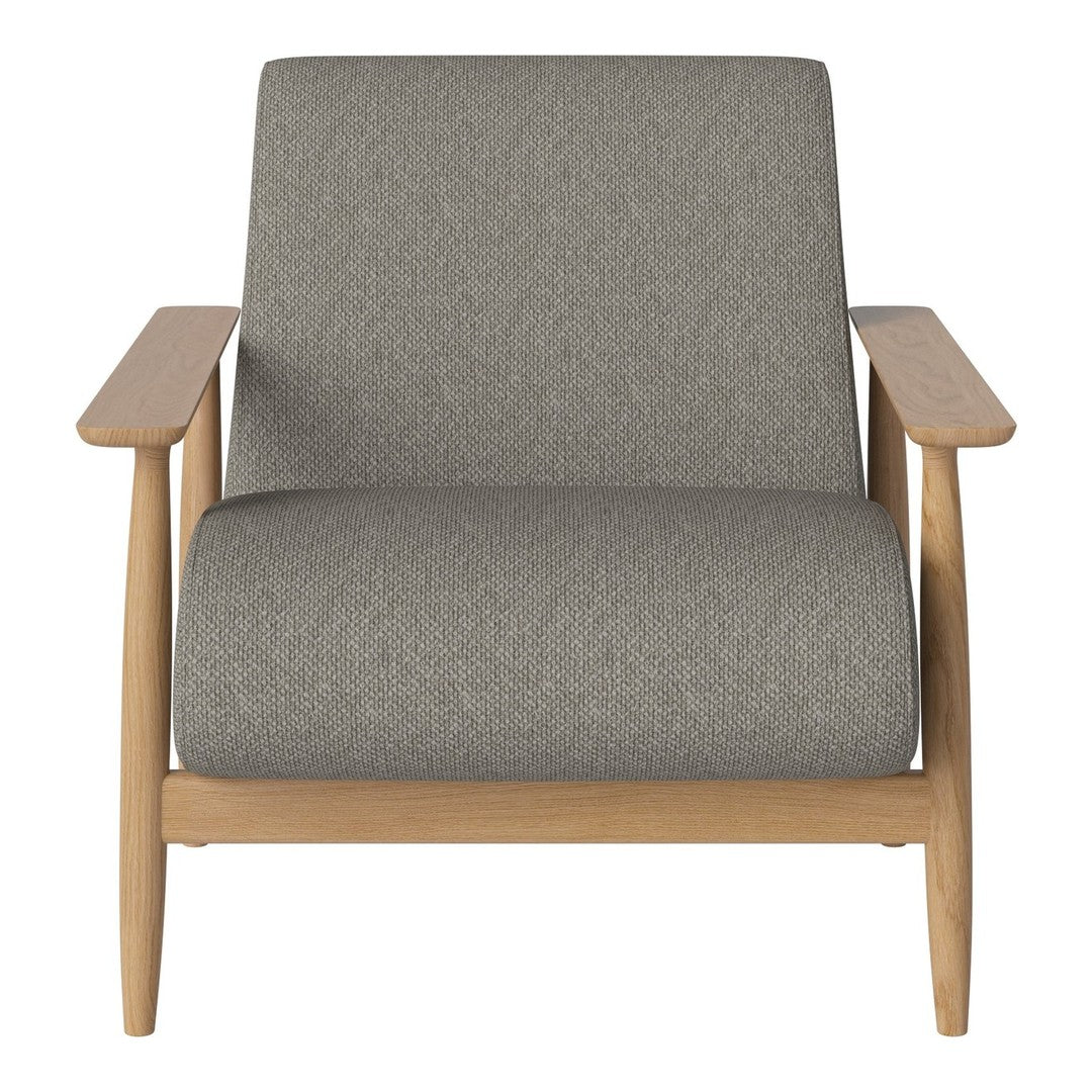 Gray upholstered armchair with a minimalist design and light wood frame. Modern style for any living space.