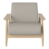 Light gray upholstery on a minimalist chair with natural wood arms, blending modern and cozy aesthetics.