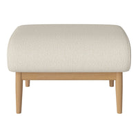 Neutral cream ottoman with a textured surface and natural wood legs, perfect for modern, minimalist decor.