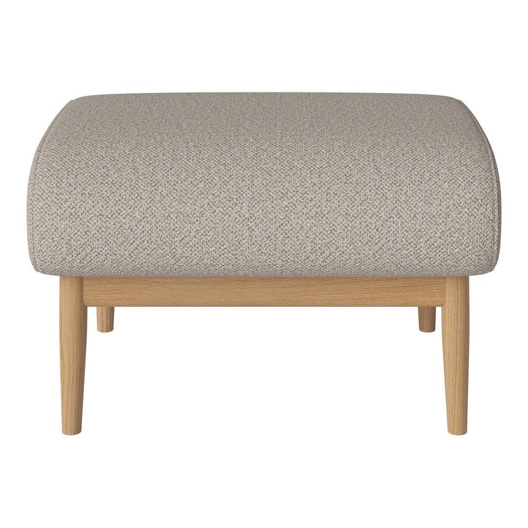 Beige textured ottoman with light wood legs, featuring a subtle pattern for a modern aesthetic.