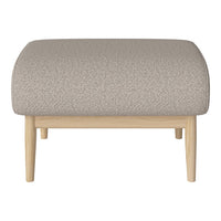 Beige textured fabric ottoman with light wood legs, featuring a subtle pattern for a stylish accent.