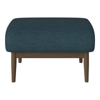 Teal upholstered ottoman with a textured pattern, featuring sturdy wooden legs in a natural finish.