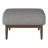 Gray upholstered ottoman with a textured finish and wooden legs. Modern design for versatile home decor.