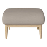 Light grey upholstered ottoman with curved top and natural wood legs, perfect for modern decor.