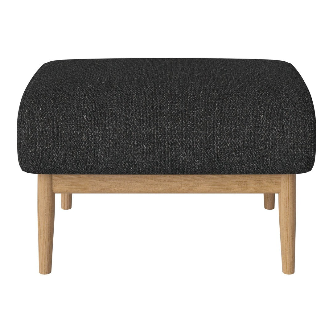 Black textured ottoman with a rounded top and natural wood legs, perfect for modern decor.