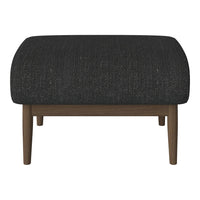 Black textured ottoman with a rounded shape and wooden legs, ideal for modern decor.