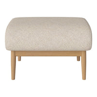 Light beige upholstered ottoman with subtle texture, featuring natural wood legs for a modern touch.