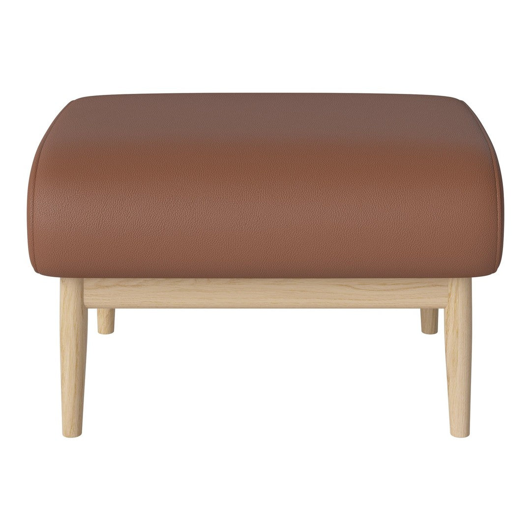 Brown upholstered ottoman with a smooth surface and light wood legs. Simple, modern design for versatile decor.