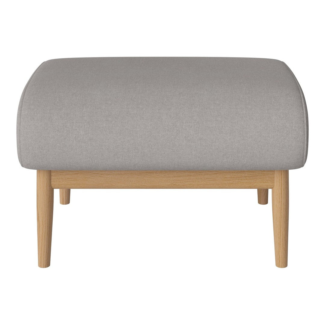 Gray upholstered ottoman with a smooth texture and light wooden legs. Minimalist design for modern decor.