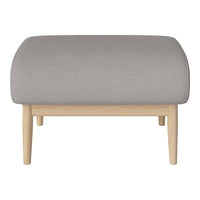 Light gray upholstered ottoman with smooth, rounded edges and natural wooden legs. Simple and modern design.
