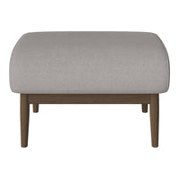 Gray upholstered ottoman with a smooth surface and wooden legs. Minimalist design perfect for modern decor.
