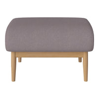 Soft gray upholstered ottoman with a rounded top and light wood legs, perfect for modern decor.
